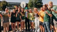 Students posing with bison horns at Homecoming groundbreaking